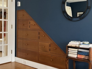 Cherry Cabinetry Tucked Beneath Stairway