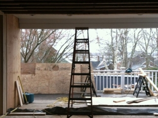 Back wall blown out to receive reclaimed glass door