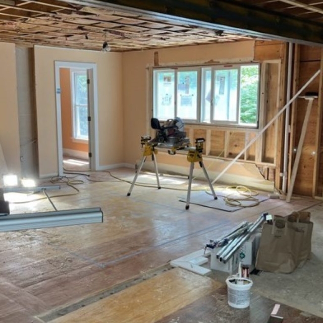 Wall removed and Large Open Space created. Floors being patched.